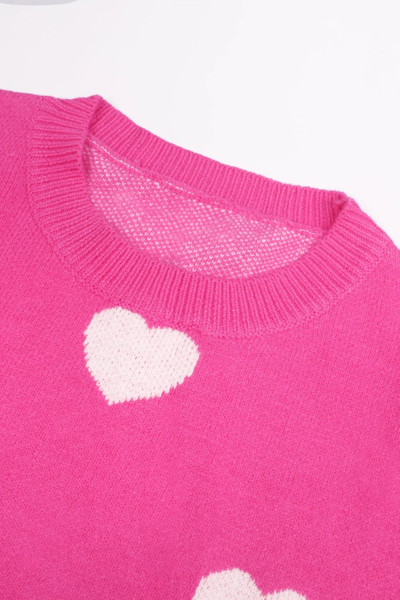 Elevate Your Casual Wardrobe with Our Hot Pink Oversized Knit Sweater Featuring a Charming Heart Pattern