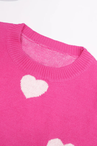 Elevate Your Casual Wardrobe with Our Hot Pink Oversized Knit Sweater Featuring a Charming Heart Pattern