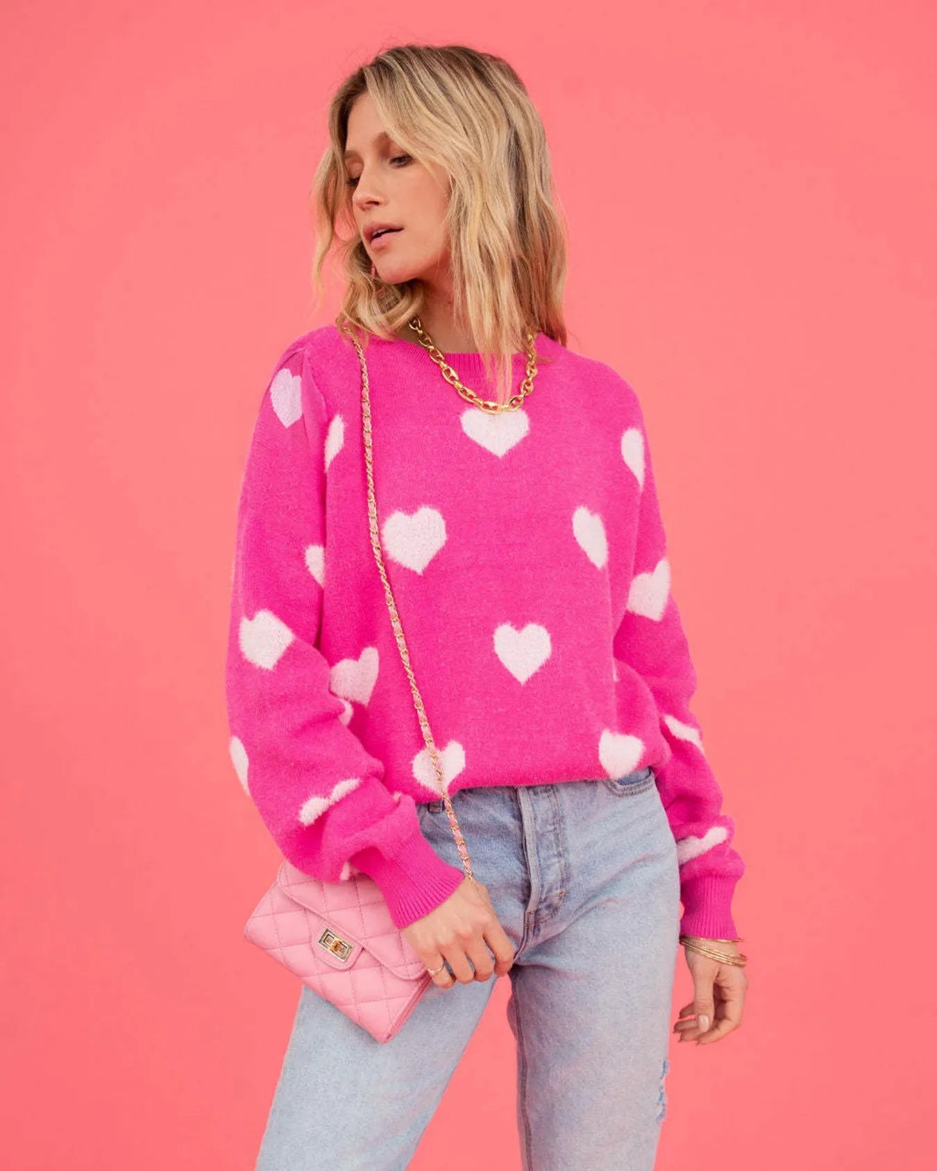 Elevate Your Casual Wardrobe with Our Hot Pink Oversized Knit Sweater Featuring a Charming Heart Pattern